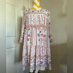 Spring floral tiered and 3/4 bell sleeved dress.